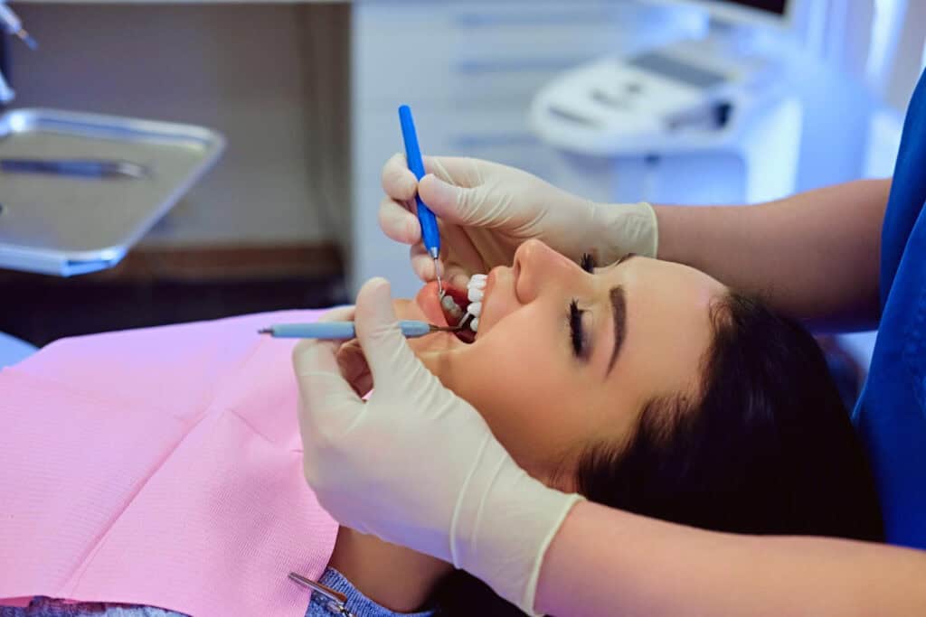 Patient receiving a dental implant evaluation to help preserve jawbone health after tooth extraction and tooth loss.